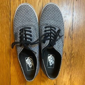 Grey and white polka-dot vans